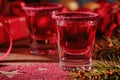 Cranberry vodka shot and Christmas decorations