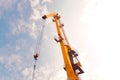 Crane against the sky with clouds Royalty Free Stock Photo