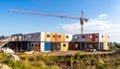 Crane Assembling Colorful Prefabricated Houses Royalty Free Stock Photo
