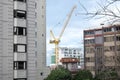 Crane in Auckland CBD with apartment buildings and office blocks