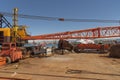 Crane barge with crane stored on the deck ready for the vessel to sail out of port.