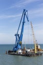 Crane barge doing marine heavy lift installation works in the gulf or the sea