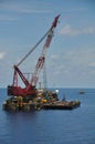 Crane barge lifting heavy cargo or heavy lift in offshore oil and gas industry. Large boat working for lift piping Royalty Free Stock Photo