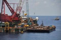 Crane barge lifting heavy cargo or heavy lift in offshore oil and gas industry. Large boat working for lift piping