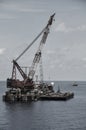 Crane barge lifting heavy cargo or heavy lift in offshore oil and gas industry. Large boat working for lift piping Royalty Free Stock Photo