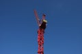 Construction crane on blue sky background