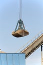 Crane bucket loaded with sand