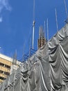 crane and building construction site against blue sky Royalty Free Stock Photo