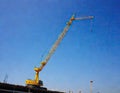 Crane and building construction site against blue sky Royalty Free Stock Photo