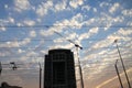 Crane and building construction site against blue sky Royalty Free Stock Photo