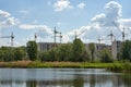 Crane building construction site blue cloudy sky background Royalty Free Stock Photo