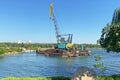 Crane building construction site house on river in sunny summer day Royalty Free Stock Photo