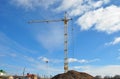 Crane Building New House on the Construction Site. House building good for economic growth. Royalty Free Stock Photo