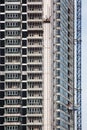 Crane and building under construction against blue sky. Royalty Free Stock Photo