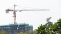 Crane on the building under construction in a white Royalty Free Stock Photo