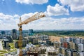 Crane and buildings under construction against blue sky background. aerial photo Royalty Free Stock Photo