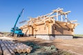 Crane builds wooden house
