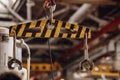 Crane chain and hook with blurred warehouse background. Concept production steel factory Royalty Free Stock Photo