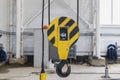 Crane chain and hook blurred warehouse background with remote control. Concept production steel factory Royalty Free Stock Photo