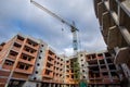 Crane construction bricks concrete building in city