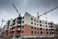 Crane construction bricks concrete building in city