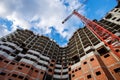 Crane construction bricks concrete building in city