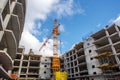 Crane construction bricks concrete building in city