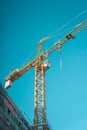 Crane on construction site background. Royalty Free Stock Photo