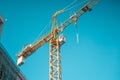 Crane on construction site background. Royalty Free Stock Photo