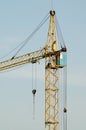 Crane at construction site in front of blue sky Royalty Free Stock Photo