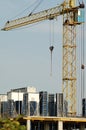 Crane at construction site in front of blue sky Royalty Free Stock Photo