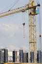 Crane at construction site in front of blue sky Royalty Free Stock Photo
