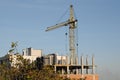 Crane at construction site in front of sky Royalty Free Stock Photo