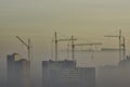 Crane and construction site in urban smog Royalty Free Stock Photo