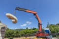 Crane with counterweight under blue sky