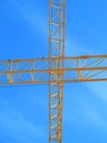 Yellow crane cross in blue sky