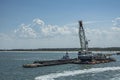 Crane on dredging platform outside Port Canaveral, Florida, USA Royalty Free Stock Photo