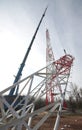 Crane elevating steel construction