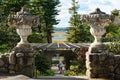 Tourist enters the ornately walled flower garden in autumn sun