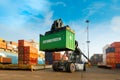 Crane fork loading cargo ship witth containers at the Port of Iquique