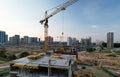 Crane during formworks on construction site. Pouring concrete into formwork. Construction the buildings and multi-storey