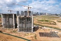 Crane during formworks on construction site. Tower cranes in action. Construction the buildings and multi-storey residential homes Royalty Free Stock Photo