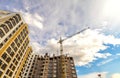 Crane and high rise building under construction against blue sky Royalty Free Stock Photo