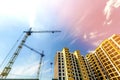 Crane and high rise building under construction against blue sky Royalty Free Stock Photo