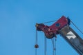 Crane Hook lifting for construction on blue sky,steel hook and chain, copy space Royalty Free Stock Photo