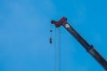 Crane Hook lifting  for construction on blue sky,steel hook and chain, copy space Royalty Free Stock Photo