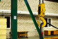 Crane hook of the overhead crane in the workshop of an industrial plant. Royalty Free Stock Photo