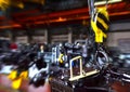 Crane hook of the overhead crane in the workshop of an industrial plant for the production of tractors and agricultural harvesters