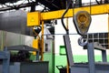 Crane hook of the overhead crane in the workshop of an industrial plant. Royalty Free Stock Photo