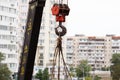 Crane hook. Tower Crane Hoist Rope against the blue sky and new building. Hawser of winch. Crane lifting cables. Construction site Royalty Free Stock Photo